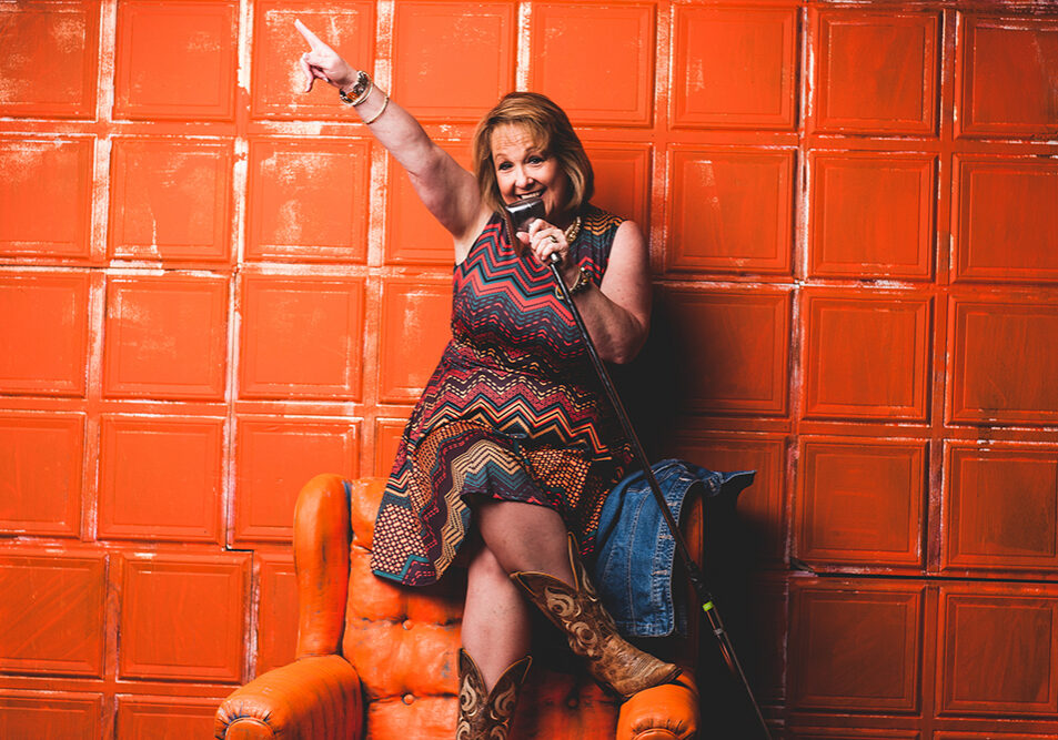 Bev_with_Mic_hands_up-resize